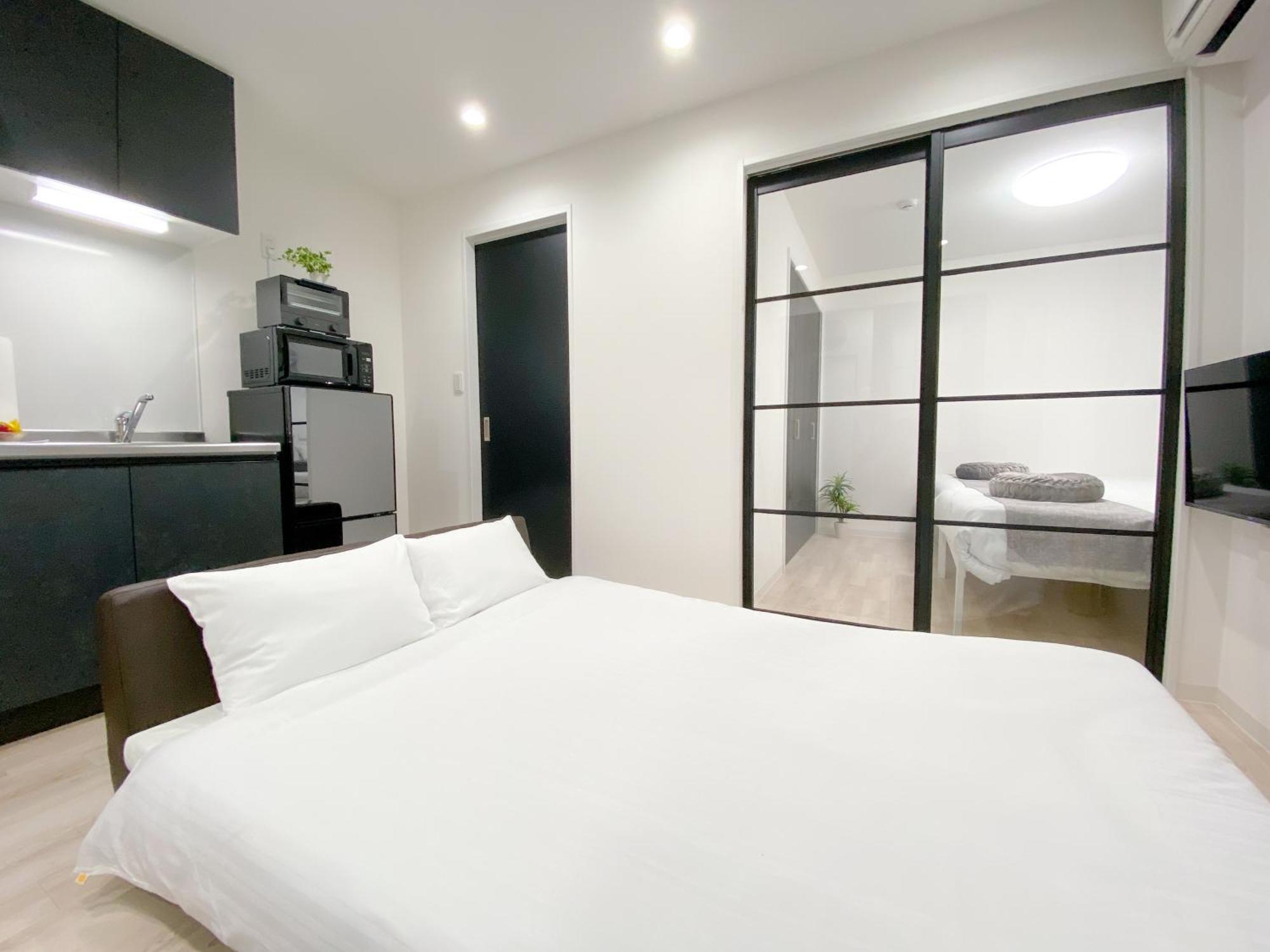 Residential Hotel Glitter Usjまで1駅5分 Osaka Bagian luar foto