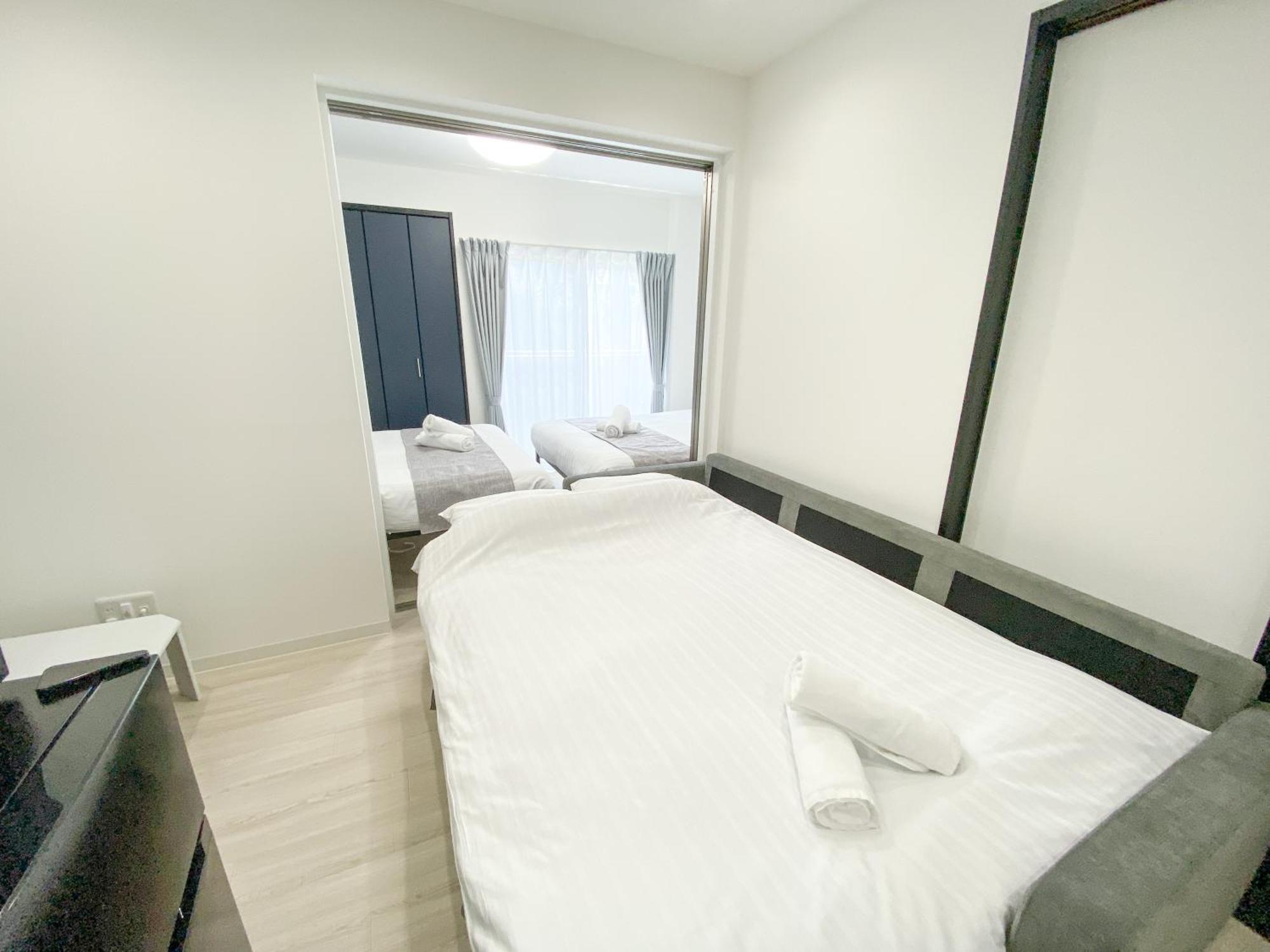 Residential Hotel Glitter Usjまで1駅5分 Osaka Ruang foto